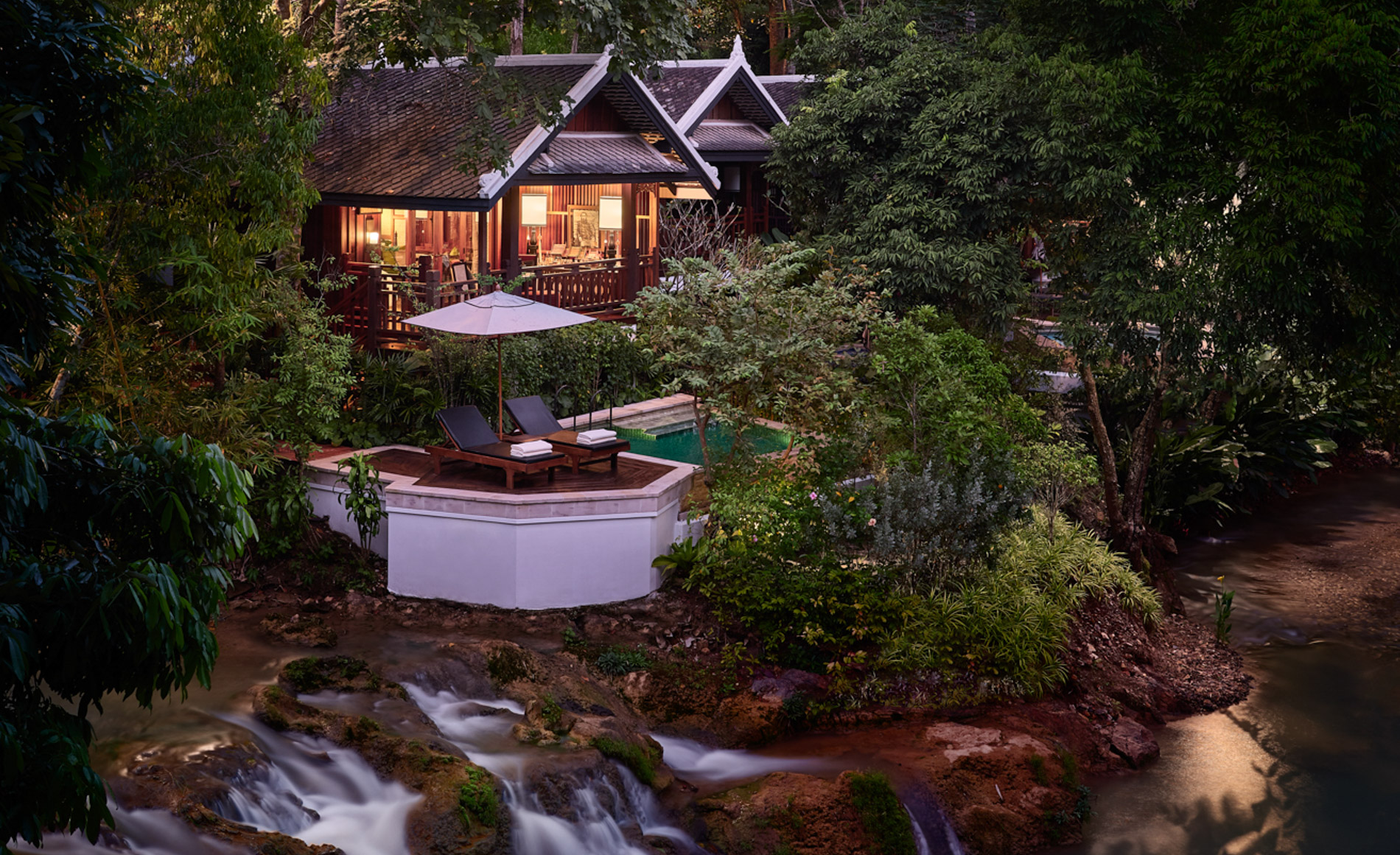 Luxury hilltop tented villa at Rosewood Luang Prabang overlooking the forest canopy